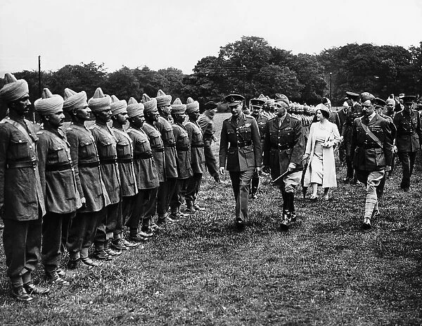 Queen Mother with King George VI at a camp for Indian Troops in Derbyshire talking to
