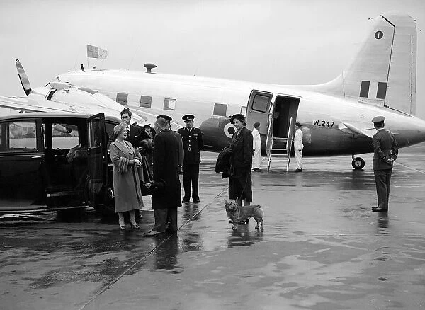 The Queen Mother is met by Sir John D Albiac, Commandant at London Airport after