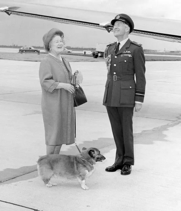 Framed Print : Queen Mother with RAF officer and corgi at Heathrow Airport in May 1983