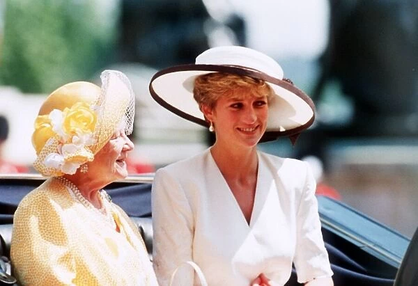 Queen Mother rides in an open top carriage with Princess Diana during the Trooping
