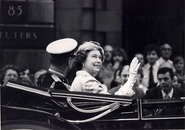 The Queen and Prince Philip riding in a carriage in Fleet Street, London