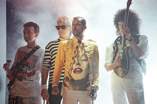 Queen rock group performing. Singer Freddie Mercury with guitarist Brian May
