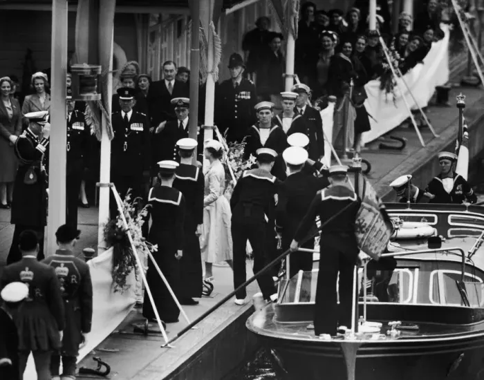 Framed Print : The Queen steps ashore from the Royal Barge at Wesminster Pier met by her family