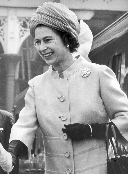 The Queen steps smiling from the Royal Train at Victoria Station