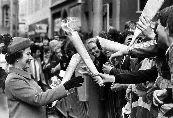 The Queen visits Manchester, 5th May 1982. Receiving bunches of flowers