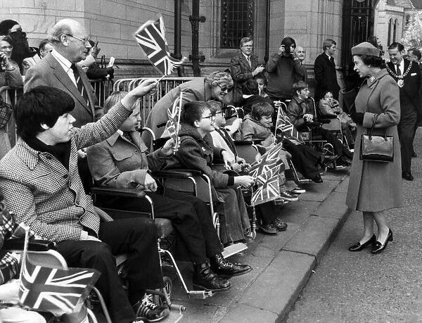 The Queen visits Manchester, 5th May 1982. Disabled youngsters provide a patriotic