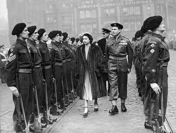 The Queen visits Manchester. Princess Elzabeth conducts an inspection of the guard in