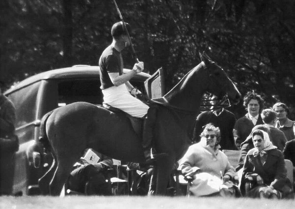 The Queen watching The Duke of Edinburgh playing Polo at Windsor soon after the birth of