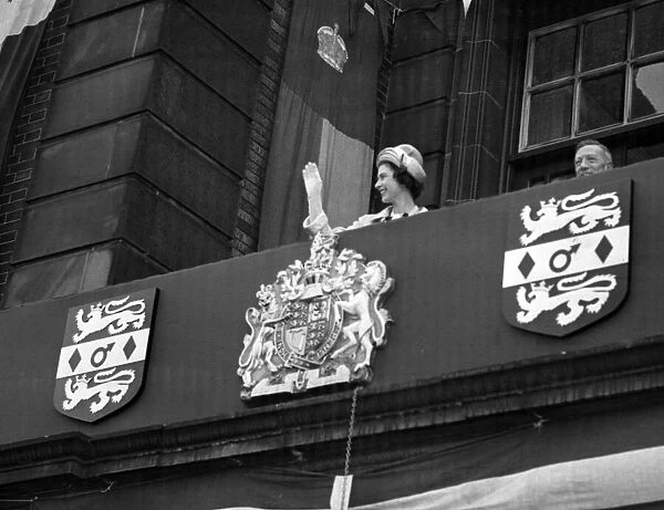 The Queen waving to the crowd from the balcony of the Wednesbury Town Hall. 24th May 1962