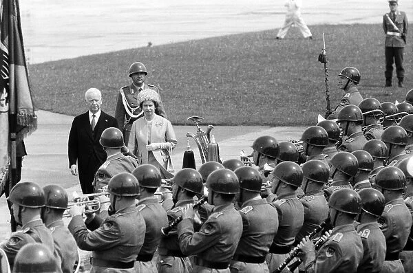 The Queen in West Germany, inspecting some West German troops with the President of