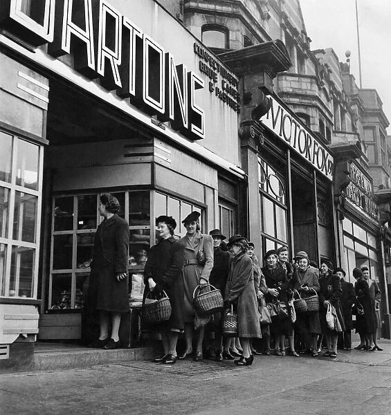 A queue is born. A million British housewives queue up each working day for one or other