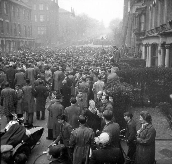 Queues of Arsenal fans ring their Highbury stadium hoping to get a ticket for the FA semi