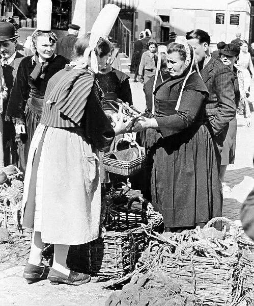 Quimper Britanny France A fishwife sells crabs at a market at Quimper in South