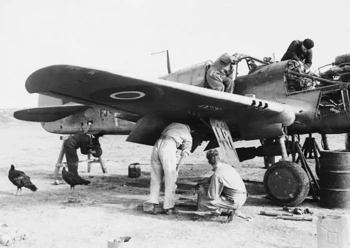 Framed Print : R. A. F. AT Advanced airfield in Italy. R. A. F. fitters busily at work on an aircraft Framed Print : R. A. F. AT Advanced airfield in Italy. R. A. F. fitters busily at work on an aircraft