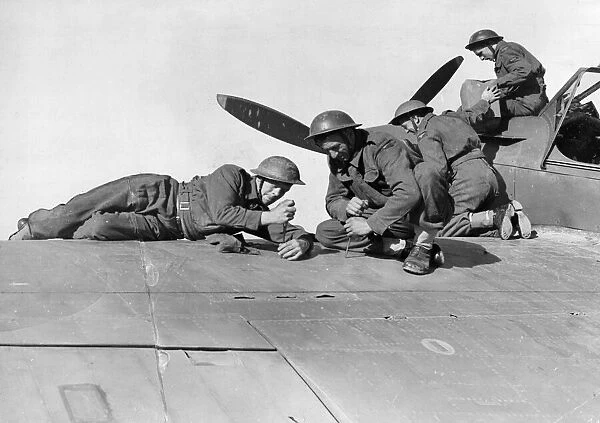 R. A. F. airmen prepare a fighter in North Africa. February 1943