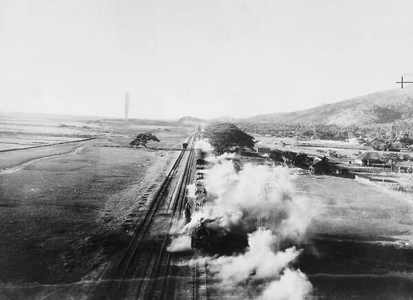 R. A. F Beaufighters attack a train in Burma. Steam pouring from the engine
