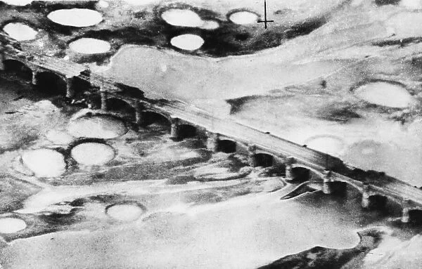 R. A. F. Kittyhawks attack railway bridge at Fano during the Second World War