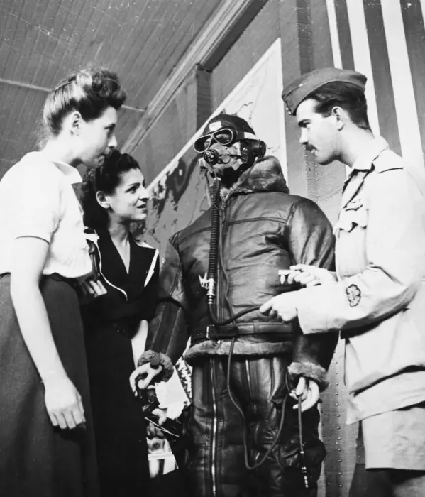 Framed Print : R. A. F. pilot speaking to french women regarding clothing worn by flying men of the R. A. F
