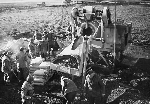 R. A. F. workers mix concrete during Second World War. 28th February 1944