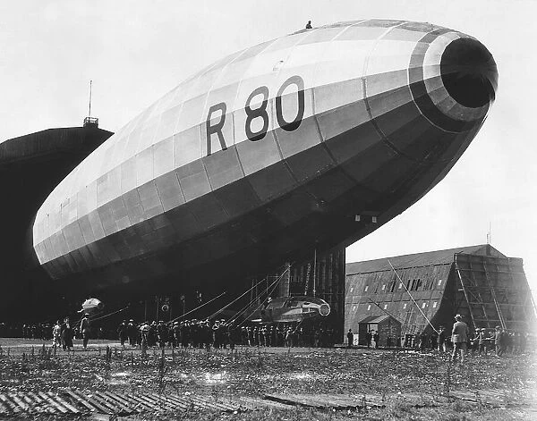 The R80 Airship being launched from it shed July 1920 The figure sitting on top of