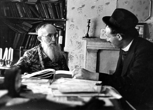 Rabbi Szpetman talks with Rabbi Jack Sheiman. The books on the table are all that is left
