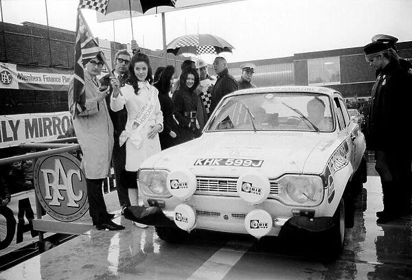 RAC Rally November 1970 Miss Great Britain Kathleen Winstanley waves off a Ford
