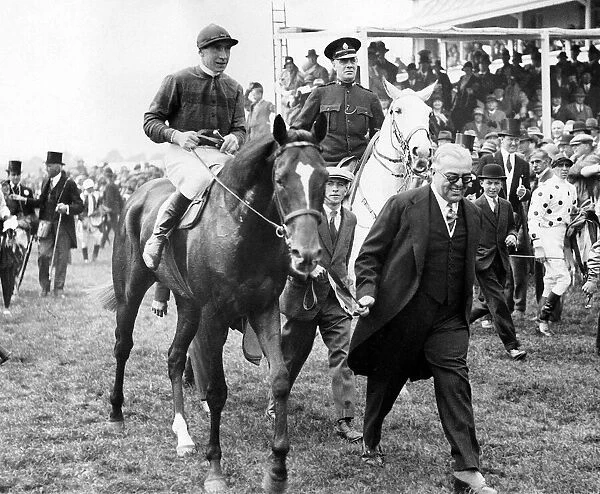 Racehorse Blenheim with jockey Harry Wragg jockey is led by owner the Aga Khan after his