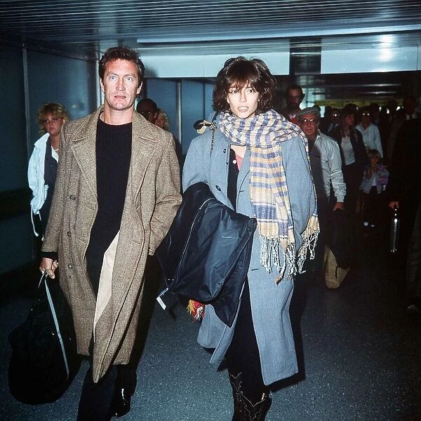 Rachel Ward arriving at London Airport with Actor Bryan Brown April 1984