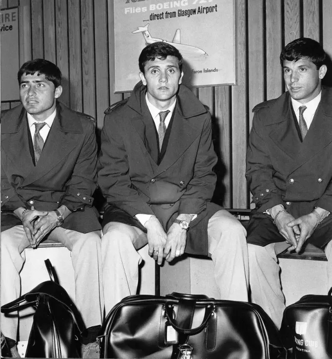 Framed Print : Racing Club of Argentina players waiting for their luggage at the airport as they land in Framed Print : Racing Club of Argentina players waiting for their luggage at the airport as they land in