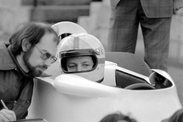 Racing driver John Surtees and his new racing car. January 1976 S76-0088