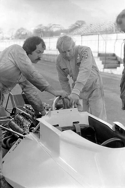 Racing driver John Surtees trying his new car. January 1976 76-00088