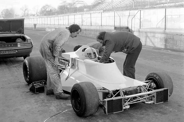 Racing driver John Surtees trying his new car. January 1976 76-00088-005