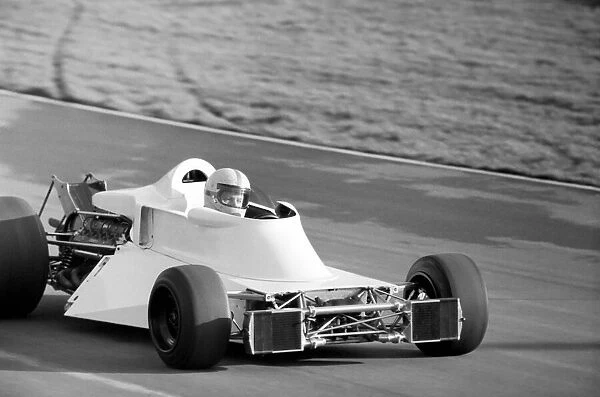 Racing driver John Surtees trying his new car. January 1976 76-00088-003
