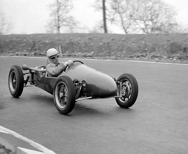 Racing driver Stewart Elroy taking his car for a practice run Circa 1955