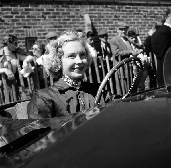 Racing at Goodwood, Carol Fisher, one of the drivers in the ladies race. 1st June 1955