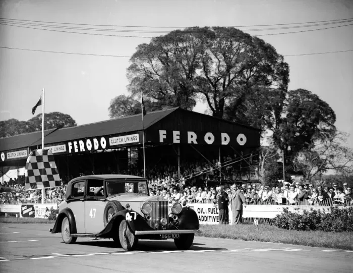 Framed Print : Racing at Goodwood, Richard Murdock crossing the finishing line in the celebrities race