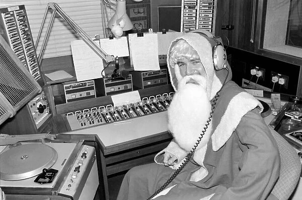 Radio One Disc Jockey Noel Edmonds dressed as Father Christmas on his breakfast show