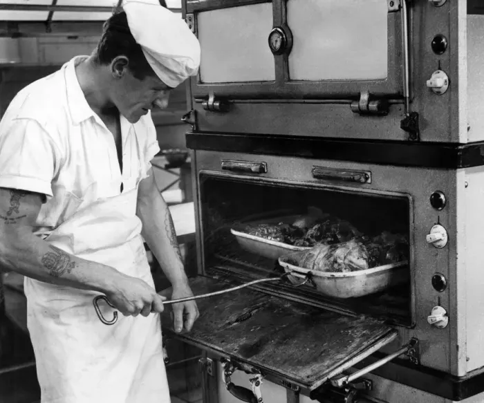 Framed Print : RAF Brawdy, Pembrokeshire, Wales. 14th July 1962. Cook J Green checks on the roast lamb Framed Print : RAF Brawdy, Pembrokeshire, Wales. 14th July 1962. Cook J Green checks on the roast lamb