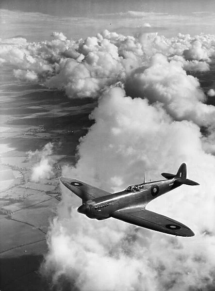 AN RAF Mark XI Spitfire in flight during the Second World War. 13th July 1944
