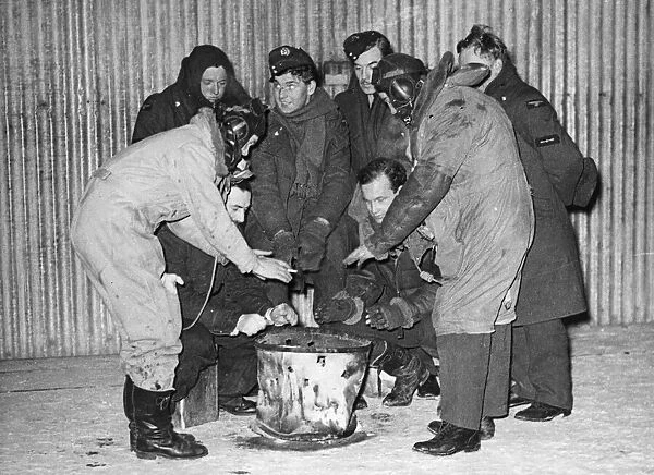 RAF men work in Arctic conditions in France. This picture was taken at night when