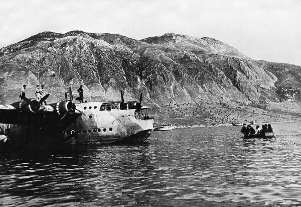 RAF personnel being rowed out to a waiting Sunderland Flying Boat