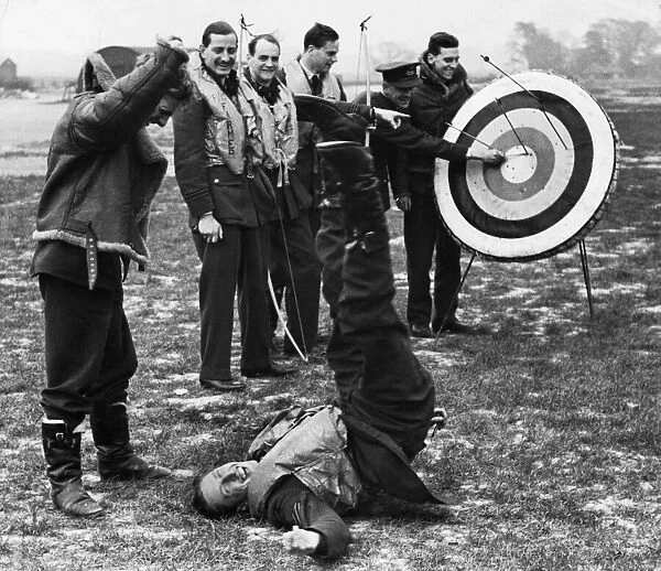 RAF pilots and crew enjoy some time out between missions with a round of archery at their