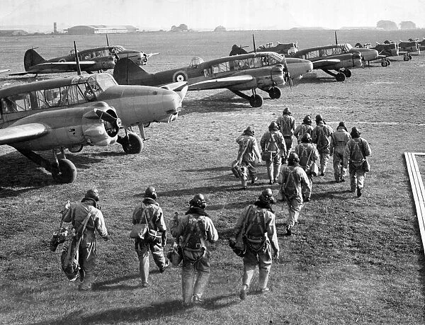 RAF pilots and crew make their way to their Avro Anson planes during World War Two