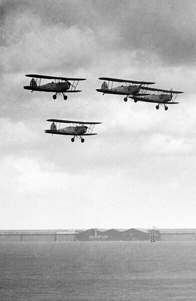 Four RAF Tiger Moth trainers flying in formation at Baginton, Coventry, West Midlands