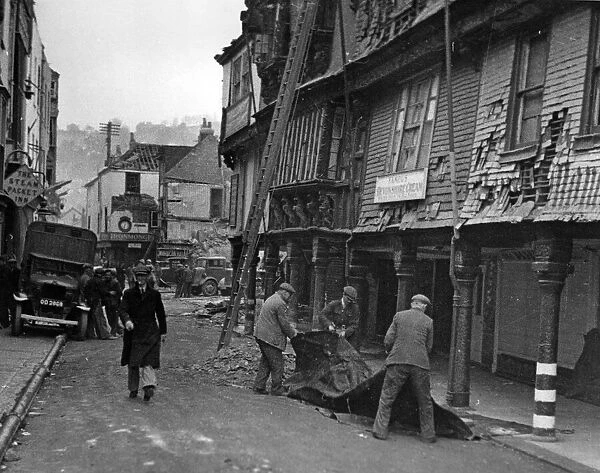 After a raid on Dartmouth, Devon, part of the towns 17th Century Butterwalk was in ruins