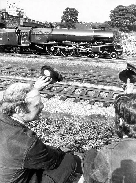 Railway enthusiasts Pete Reid from Ken and Dave Wescott from Derby salute the pass by of