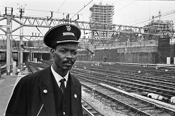 Railway guard seen here at Euston Station. 15th August 1966