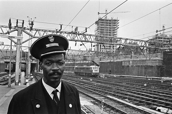 Railway guard seen here at Euston Station. 15th August 1966