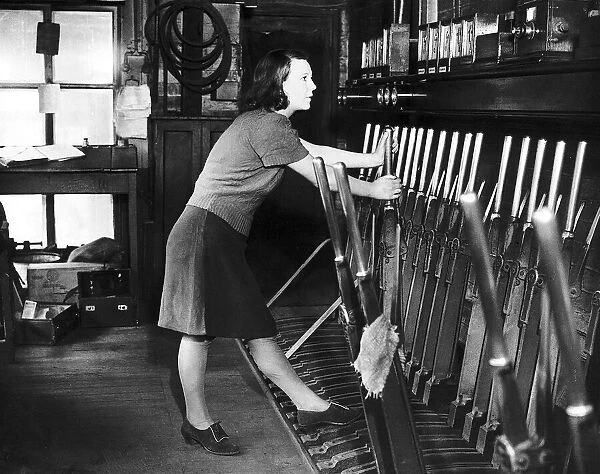 Railway signalwoman Mrs Edna Sellars signals an oncoming munitions train during