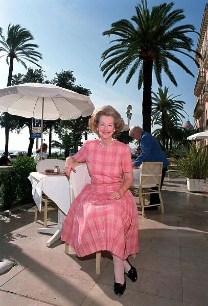 RAINE SPENCER, COUNTESS OF CHAMBRUN, IN NICE SITTING OUTSIDE ON RESTAURANT PATIO IN FRONT